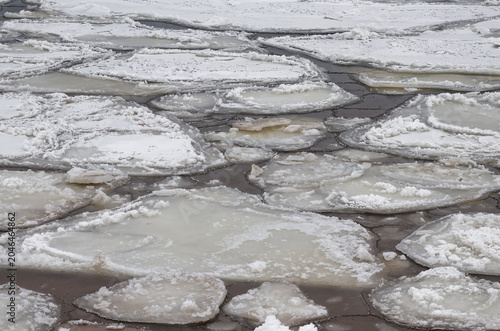 Close-up of thick ice fragments on a frozen river surface