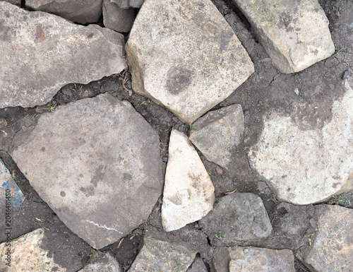 Uneven stone path with soil and blue stone