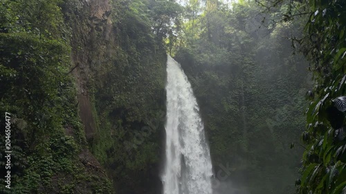 Nungnung Waterfall Cascading Through Tropical Rainforest, Bali, Indonesia