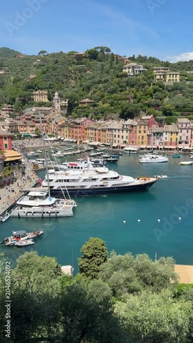 Beautiful views of Portofino Italy with boats and colorful buildings in the harbor on a sunny day