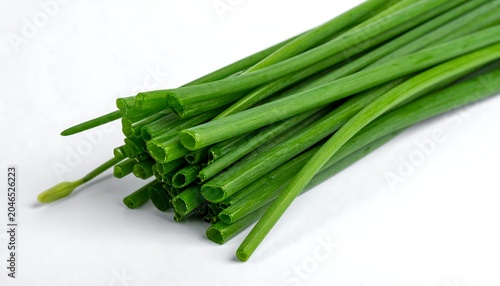 A bunch of fresh green chives on a white background
