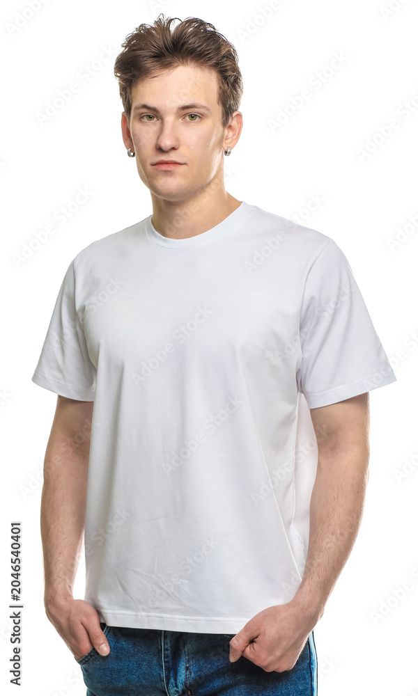 Obraz premium Handsome young man wearing blank t-shirt on white background. Mockup for design