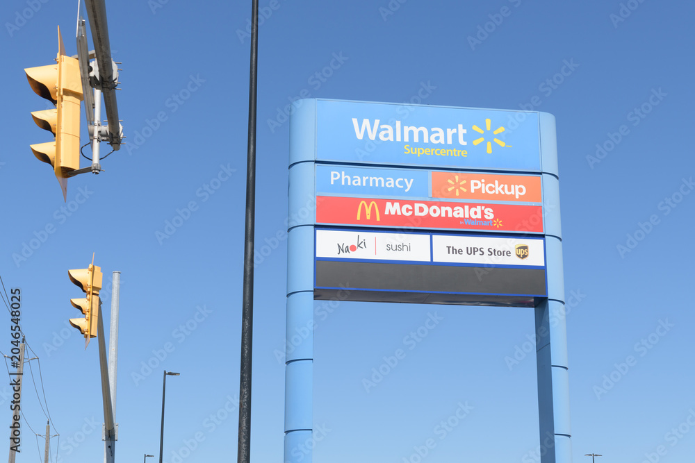 Obraz premium road side pylon sign of Walmart Supercentre, a department store chain, located here at 2525 St Clair Av W inside SmartCentres Toronto