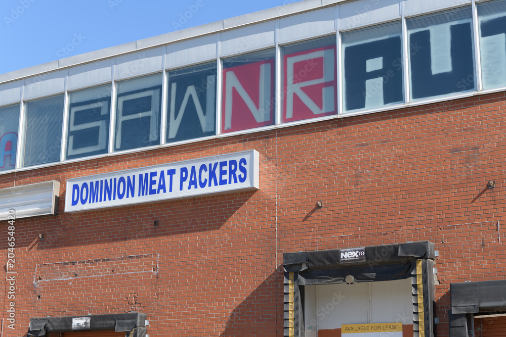 Obraz premium ghost sign of Dominion Meat Packers at former meat processing plant located at 2255 St Clair Av W, Toronto