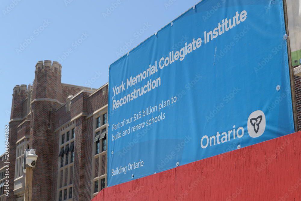Naklejka premium Gov of Ontario blue banner outside reconstruction of York Memorial Collegiate Institute, a TDSB senior high school, located at 1700 Keele St, Toronto