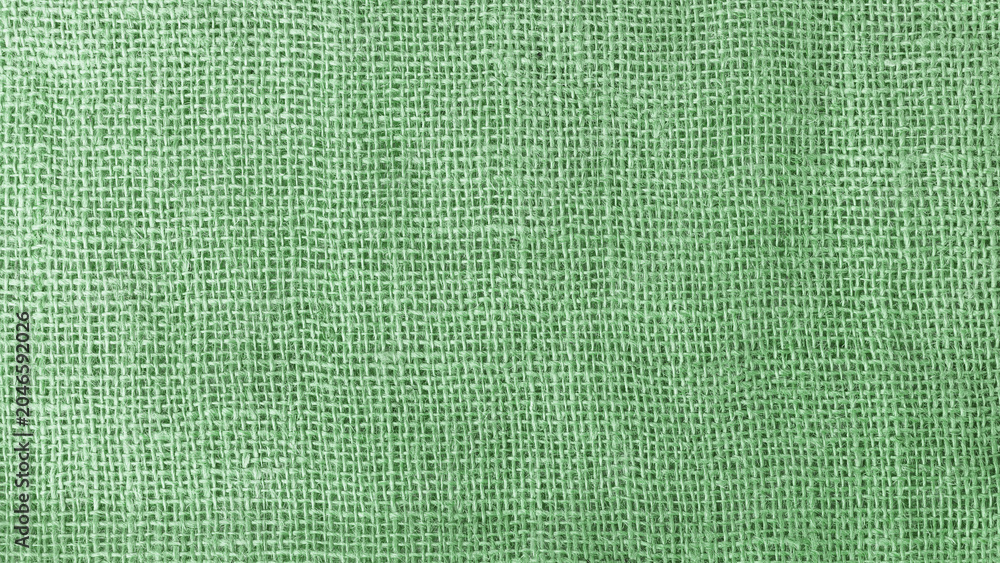 Fototapeta premium Coarse Green canvas background with a pronounced mesh structure