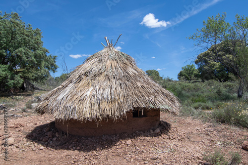 Palm thatched adobe brick hut in Spain