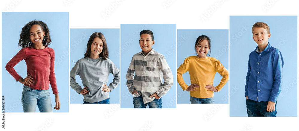 Obraz premium Happy Diverse Children Smiling Together In Studio, Posing In Front Of Camera With Casual Clothing, Expressing Friendship And Joy In A Bright Background. Embracing Diversity And Unity