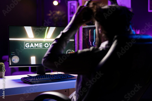 фотографія Upset gamer berating teammates after losing online competitive multiplayer match, feeling frustrated