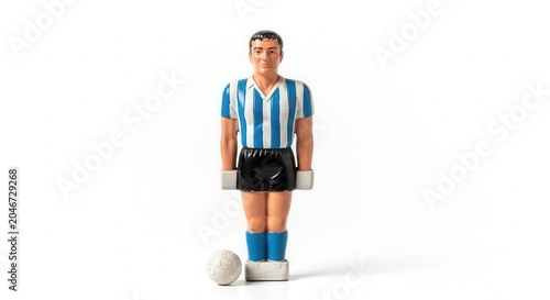 Table Football Player Figurine with Ball on White Background.