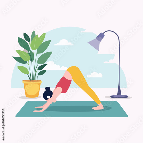 Woman practicing yoga in downward dog pose at home