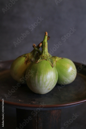 Thai eggplant on black background, representing healthy organic vegetable food from the garden. 
