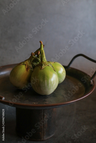 Thai eggplant on black background, representing healthy organic vegetable food from the garden. 
