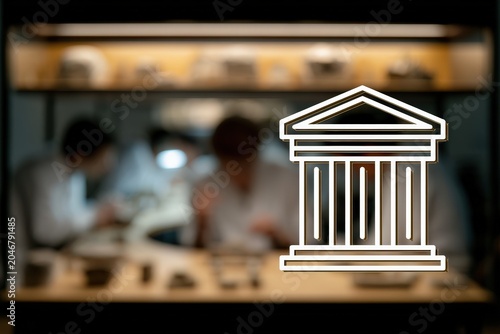 A museum conservation laboratory featuring historical artifacts and professionals at work. The image shows intricate details of restoration efforts in a focused environment