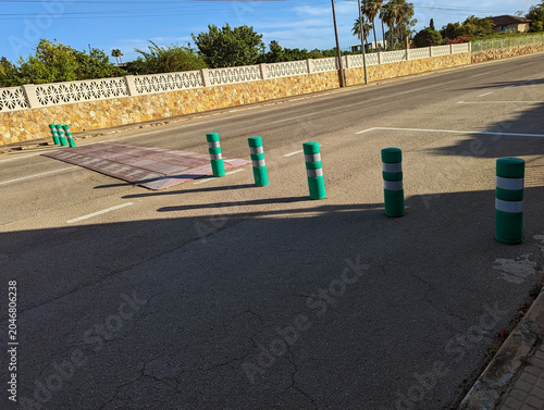 Принти на полотні Urban traffic segregation system with safety bollards, lane delineation and protection measures in Mallorca residential neighborhood