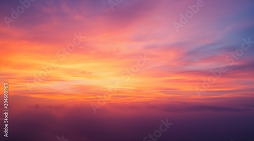 Vibrant sky gradients blend warm hues during a serene twilight hour for calming inspiration