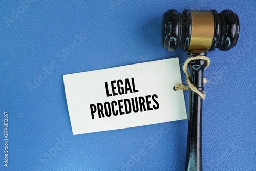 Hammer the judge and tag the paper with the word legal procedures. established rules and methods used to carry out legal actions—such as civil lawsuits or criminal prosecutions.