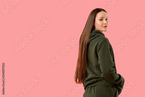 Young woman in green hoodie...