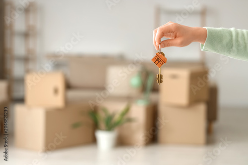 Female hand holding key fro...