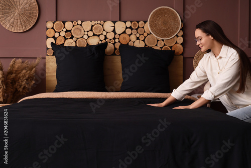 Pretty young woman making b...