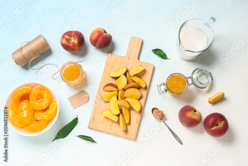 Wooden board with sliced pe...