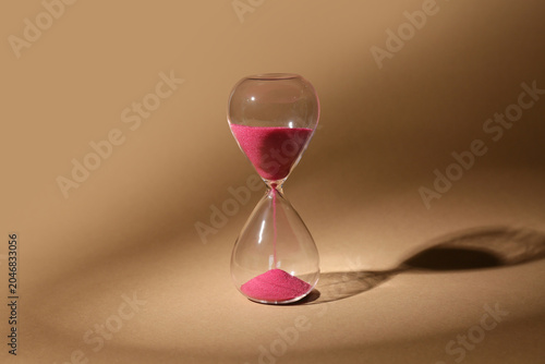 Crystal hourglass on beige ...