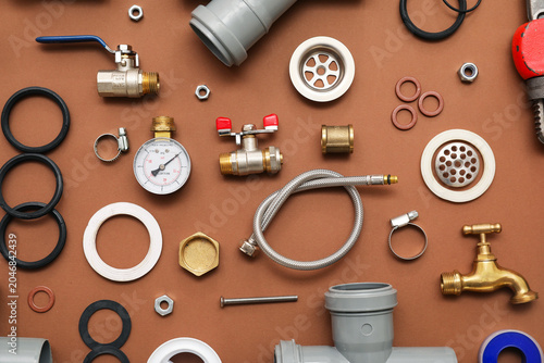 Set of plumber's items on b...