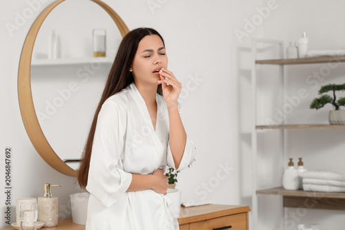 Young woman with menstrual ...