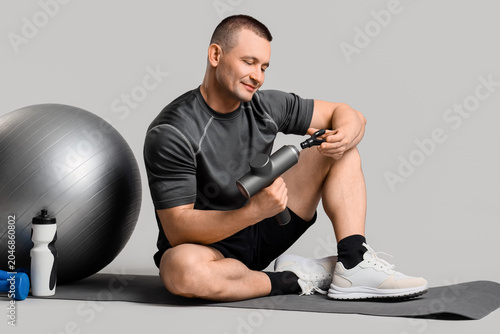 Sporty young man with percu...