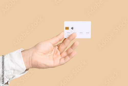Male hand with credit card ...