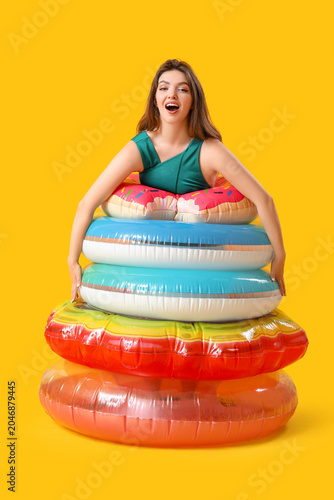 Young woman with swim rings...