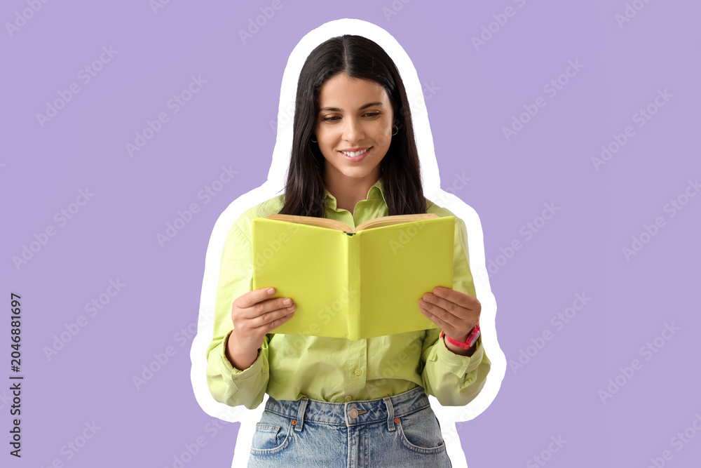 Fototapeta premium Beautiful woman reading book on lilac background