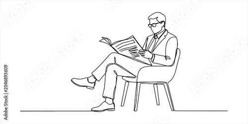 Man in suit sitting and reading newspaper