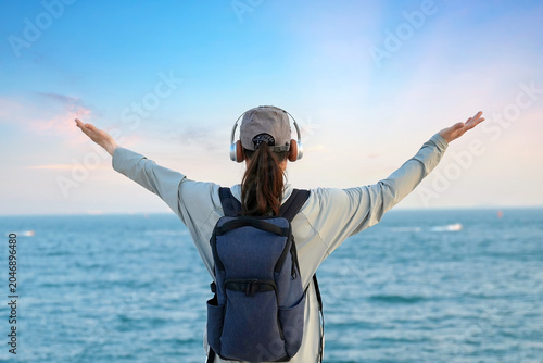 Young Hiker Embracing The Ocean View At Sunset