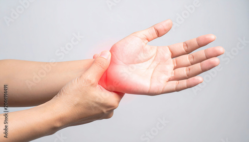 Healthcare-focused image showing painful hand joints and inflamed regions emphasized in red.