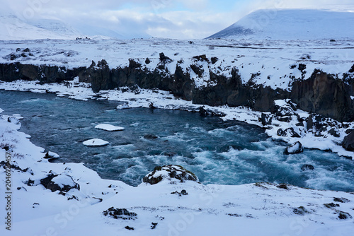 Snowy River Canyon in Winter With Turquoise Rapids and Snow-Covered Cliffs