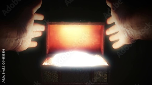 Opening a mysterious wooden box with unknown treasure bright glowing light.