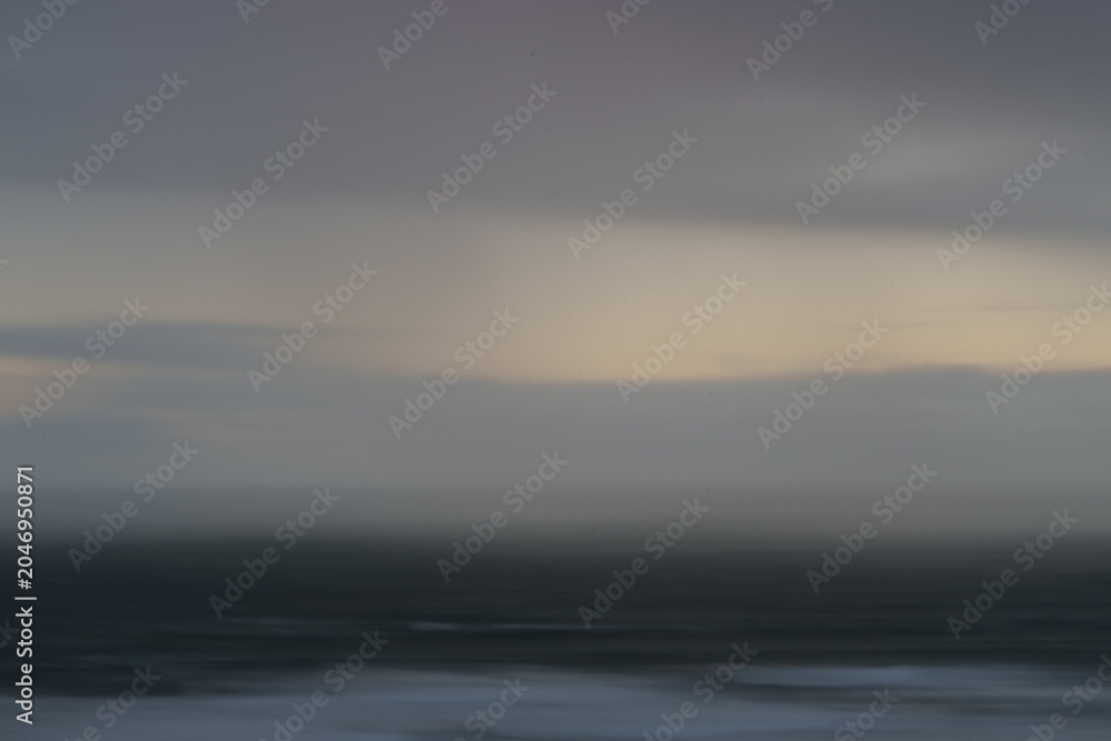 Obraz premium Impressionist coastal dark and moody view to horizon at Ripiro Beach Northland New Zealand.