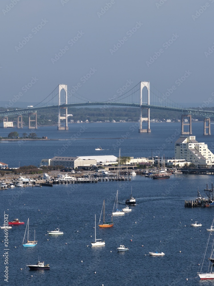 Obraz premium Newport, Rhode Island, USA - aerial view of harbor, sailboats and Claiborne Pell Bridge on a clear day. g.