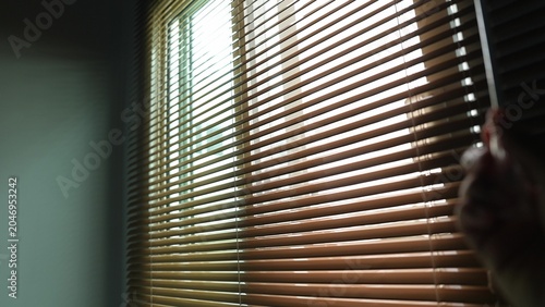 Bild auf Leinwand Allowing sunlight through the blinds brightens the space naturally, reducing reliance on electric lighting and encouraging sustainable energy use that benefits both the environment and society