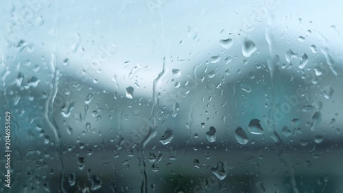 Quadro em tela Looking out at rain streaking down the window, this view from inside symbolizes comfort, shelter, and reflection, while evoking ideas of coziness, solitude, weather, and home protection