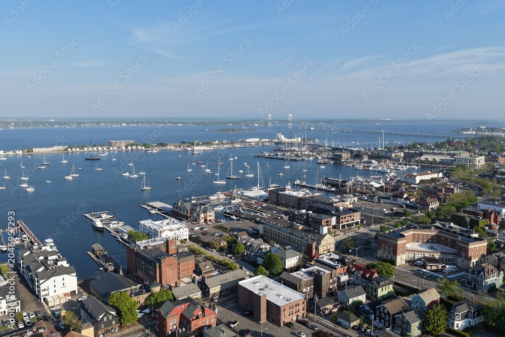 Fototapeta premium Newport, Rhode Island, USA - aerial view of harbor, sailboats and Claiborne Pell Bridge on a clear day. g.
