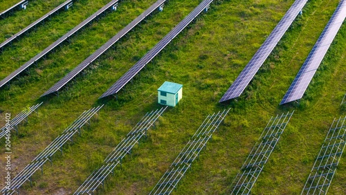 Newly installed solar panels in a renewable energy field, view of racked solar panels in a field, installing new power needed to generate energy from the sun.