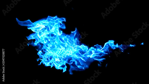 Bild auf Leinwand Blue flames blazing against a black background