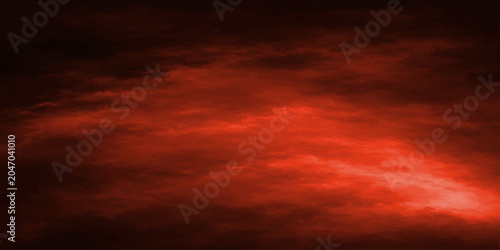 Beautiful evening sky with dark red and orange clouds during a dramatic sunset nature landscape