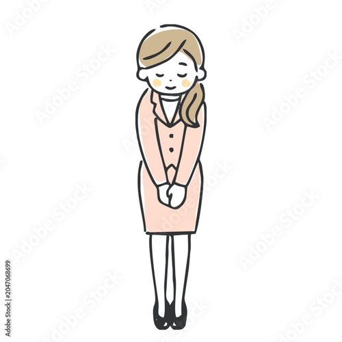 お辞儀するスーツの女性