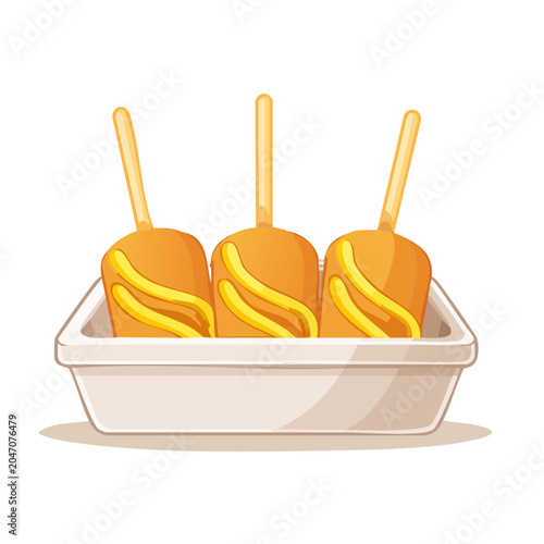 Three corn dogs with mustard in a tray