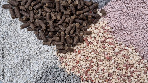 Various types of fertilizers, ash and granulated manure. Space for text. Selective focus