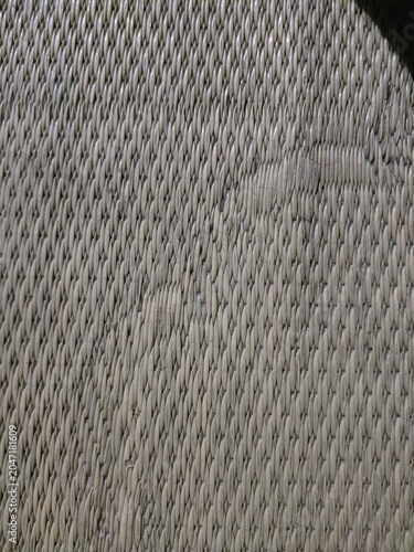 Obraz na plátně Close up of woven fabric with repeating diamond-shaped mesh pattern in light gra