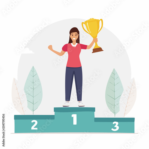 Woman holding a trophy on a winner's podium